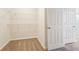 Walk-in closet with carpet, white walls, and white shelving at 5955 Sweet Birch Dr, Riverview, FL 33578