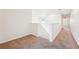 Upstairs hallway with cozy carpet and ample natural light at 5955 Sweet Birch Dr, Riverview, FL 33578