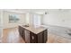 Open concept kitchen with large island, stainless steel dishwasher, and breakfast area at 5955 Sweet Birch Dr, Riverview, FL 33578
