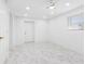 Bright, renovated bedroom featuring marble tile flooring at 6012 Larmon St, Tampa, FL 33634