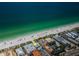 Amazing aerial view of a beachfront property near ocean, with a nearby street and clear blue ocean at 614 Gulf Blvd # 4, Indian Rocks Beach, FL 33785