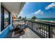 Enjoy stunning ocean views from this condo's private balcony with seating area and coastal decor at 614 Gulf Blvd # 4, Indian Rocks Beach, FL 33785