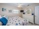 Bright bedroom with beach-inspired decor, a dresser with a mirror, and a relaxing atmosphere at 614 Gulf Blvd # 4, Indian Rocks Beach, FL 33785