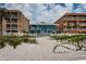 Charming blue beach house nestled between neighboring buildings, offers direct access to the beach at 614 Gulf Blvd # 4, Indian Rocks Beach, FL 33785