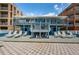 Exterior view of the complex featuring patios, balconies, and beach access at 614 Gulf Blvd # 4, Indian Rocks Beach, FL 33785