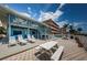 Exterior of the building showing patios, picnic tables and beach access at 614 Gulf Blvd # 4, Indian Rocks Beach, FL 33785