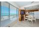 Bright dining area and kitchen space offering beautiful ocean views from the large window at 614 Gulf Blvd # 4, Indian Rocks Beach, FL 33785