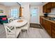 Inviting living area with eat-in kitchen, natural lighting, and scenic ocean views at 614 Gulf Blvd # 4, Indian Rocks Beach, FL 33785
