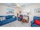 Relaxing living room featuring comfortable seating, beach-themed artwork, and stylish decor at 614 Gulf Blvd # 4, Indian Rocks Beach, FL 33785
