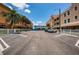 Street view with multiple parking spots and views of the surrounding complex at 614 Gulf Blvd # 4, Indian Rocks Beach, FL 33785