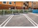 Reserved parking spaces in front of the building with well-maintained landscaping at 614 Gulf Blvd # 4, Indian Rocks Beach, FL 33785