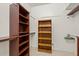 Walk-in closet with custom shelving and ample storage space at 7531 Jeno St, Zephyrhills, FL 33540