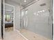 Walk in shower with subway tile and glass surround, with a bedroom view at 9708 Highland Park Pl, Palmetto, FL 34221