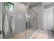 Contemporary bathroom with a glass-enclosed shower, gray subway tile, and neutral color scheme at 9708 Highland Park Pl, Palmetto, FL 34221