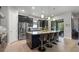 Stylish kitchen with a spacious island, stainless steel appliances, and dark modern cabinetry at 9708 Highland Park Pl, Palmetto, FL 34221