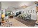 Open-concept living and dining areas with stylish furnishings and elegant lighting fixtures at 9708 Highland Park Pl, Palmetto, FL 34221