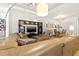 Spacious living room featuring a large leather sectional and a decorative entertainment center at 9708 Highland Park Pl, Palmetto, FL 34221