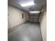 Garage area featuring a large open space and painted walls at 10102 Cedar Dune Dr, Tampa, FL 33624