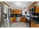 Modern kitchen with stainless steel appliances, granite countertops, and custom wood cabinetry at 1081 N Euclid Ave, Sarasota, FL 34237