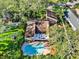 An aerial view of the home showing the private pool, well-maintained roof, and backyard at 11712 Palmer Dr, Tampa, FL 33624