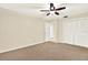 Bedroom with carpet, featuring closet and open doorway leading to other rooms at 11712 Palmer Dr, Tampa, FL 33624