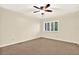 Bedroom featuring a window with shutter blinds, ceiling fan, and carpet flooring at 11712 Palmer Dr, Tampa, FL 33624