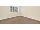 Bedroom featuring a window with blinds and carpet flooring at 11712 Palmer Dr, Tampa, FL 33624