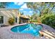 Backyard pool surrounded by brick pavers at 11712 Palmer Dr, Tampa, FL 33624