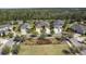 Aerial view of the new property and surrounding neighborhood provides an overview of the area's layout and location at 11714 Wrought Pine Loop, Riverview, FL 33569