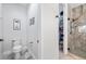 Well-maintained half-bath with toilet and nearby walk-in shower and closet at 11714 Wrought Pine Loop, Riverview, FL 33569