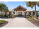 Community clubhouse featuring a welcoming entrance and well-maintained landscaping at 11714 Wrought Pine Loop, Riverview, FL 33569
