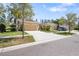 Charming single-story home with a two-car garage, lush landscaping, and a well-maintained lawn at 11714 Wrought Pine Loop, Riverview, FL 33569