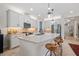 Bright kitchen features a center island with seating, modern appliances and stylish countertops at 11714 Wrought Pine Loop, Riverview, FL 33569