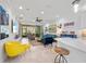 Bright, open-concept living space with modern decor and easy access to outdoor patio at 11714 Wrought Pine Loop, Riverview, FL 33569