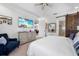 Bedroom featuring a serene atmosphere with sliding barn door leading to the bathroom at 11714 Wrought Pine Loop, Riverview, FL 33569