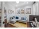 Cozy home office with comfortable seating, stylish decor, and a modern workout machine at 11714 Wrought Pine Loop, Riverview, FL 33569