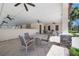 Spacious covered outdoor patio area with tables and chairs, ideal for relaxing and enjoying the outdoors at 11714 Wrought Pine Loop, Riverview, FL 33569
