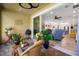 Cozy covered patio area with comfortable seating and view into the bright, airy living room at 11714 Wrought Pine Loop, Riverview, FL 33569