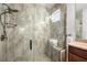 Walk-in shower featuring stylish tiling, a rain shower head, and built-in bench at 11714 Wrought Pine Loop, Riverview, FL 33569