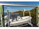 Boat lift with a boat, offering easy access to the water and stunning waterfront views at 12808 Harborwood Dr, Largo, FL 33774