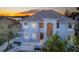 Home featuring a light blue exterior, arched entry, and manicured front yard at 12808 Harborwood Dr, Largo, FL 33774