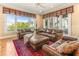 Cozy living room with plush seating, elegant decor, and a view of the waterfront at 12808 Harborwood Dr, Largo, FL 33774