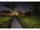 Scenic boardwalk through lush greenery leading to a serene outdoor space at 12808 Harborwood Dr, Largo, FL 33774