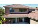 View of the house highlighting a tile roof, back patio and sliding glass doors leading to the home's interior at 12847 Darby Ridge Dr, Tampa, FL 33624