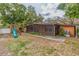 Backyard featuring lush landscaping, a spacious patio, and a playset at 1301 45Th N Ave, St Petersburg, FL 33703