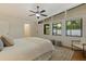Bedroom with high windows, neutral decor, wood floors, and comfortable seating at 1301 45Th N Ave, St Petersburg, FL 33703