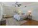 Bright, spacious bedroom featuring a ceiling fan, wood floors, and a stylish rug at 1301 45Th N Ave, St Petersburg, FL 33703