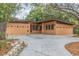 Exterior of a stylish home with a concrete driveway and modern facade, enhancing its curb appeal and character at 1301 45Th N Ave, St Petersburg, FL 33703