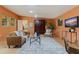 Cozy living room with a tan sofa, tile floors, ceiling fan, and windows at 1301 45Th N Ave, St Petersburg, FL 33703