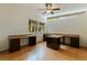 Spacious office with abundant natural light, built-in desks, and laminate wood flooring at 1301 45Th N Ave, St Petersburg, FL 33703